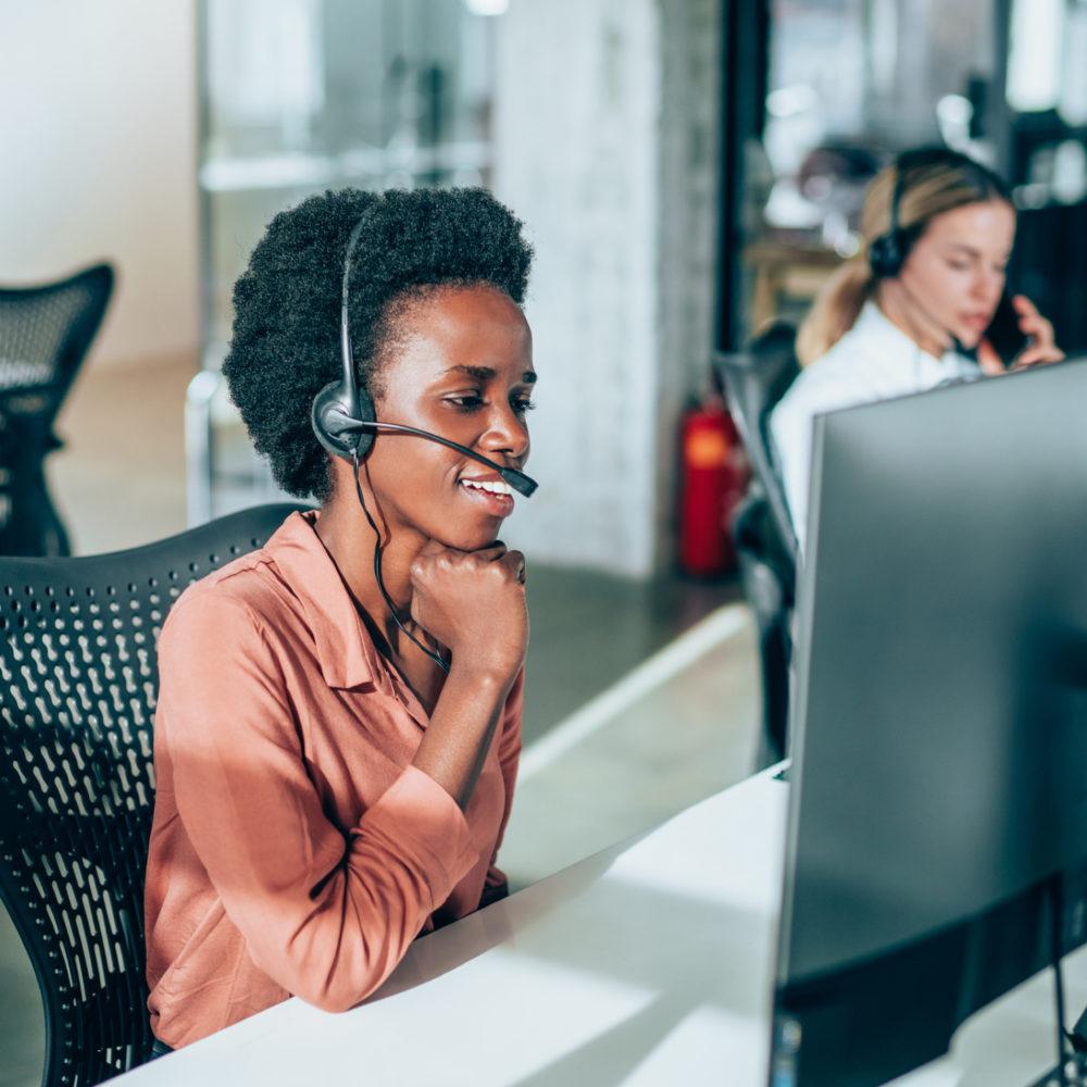 woman on headset talking through Oracle storage support